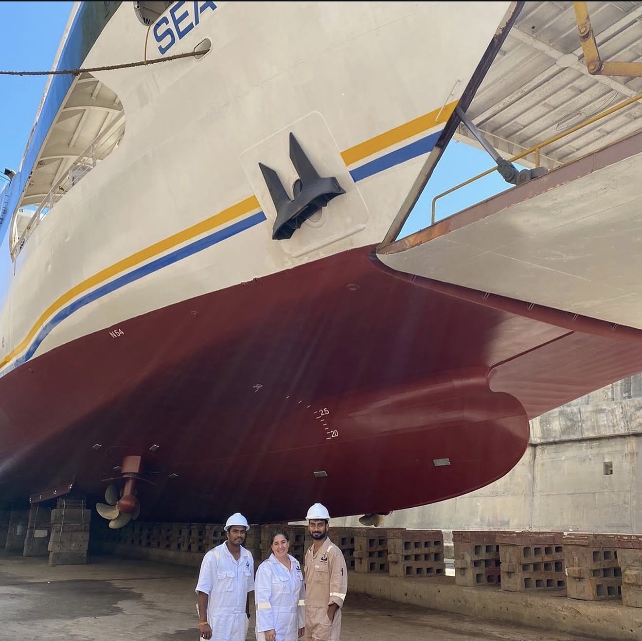 Vessel hull and personnel during dry-dock work